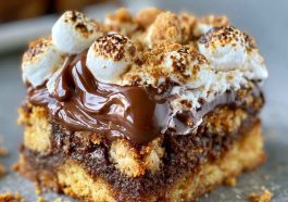 Gooey s'mores cookie bars layered with melted chocolate, toasted marshmallows, and a soft cookie base.