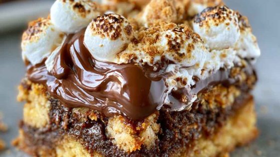 Gooey s'mores cookie bars layered with melted chocolate, toasted marshmallows, and a soft cookie base.