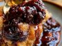 Warm Southern chocolate cobbler with a rich fudgy sauce beneath a soft chocolate cake topping, served with a scoop of vanilla ice cream.