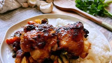 Juicy honey garlic chicken thighs coated in a sticky sweet garlic sauce and garnished with fresh parsley.