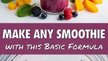 Creamy healthy fruit smoothie made with frozen mixed berries, poured into a clear glass with fresh blueberries scattered on top.