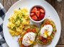 Healthy scrambled eggs with strawberries and avocado toast on a plate.Healthy Breakfast
