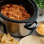 Easy BBQ chicken recipe – Crockpot chicken served with tangy BBQ glaze.