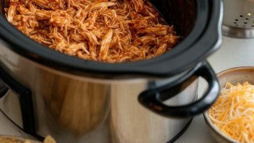 Easy BBQ chicken recipe – Crockpot chicken served with tangy BBQ glaze.