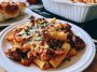 Cheesy Baked Ziti with layers of pasta, rich meat sauce, ricotta, and melted mozzarella baked until golden.