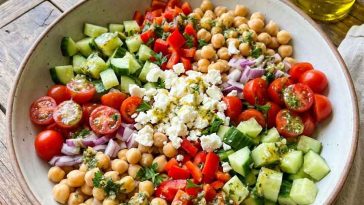 “Colorful chickpea salad with tomatoes, cucumbers, and parsley”